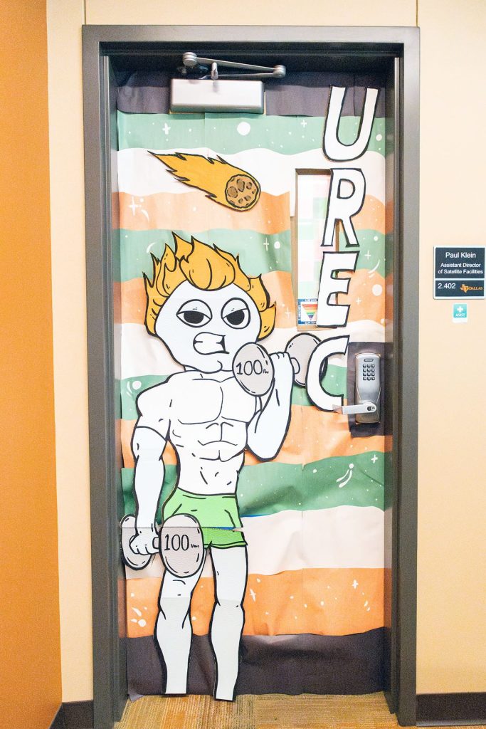 Homecoming Door Decoration: Muscular Temoc does arm curls with weights - RCW 2.402